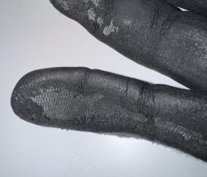 Why does a micro-foam nitrile coating peel off after a short time?